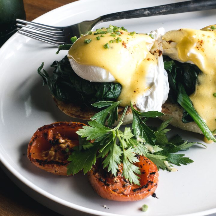 Foodiesfeed com poached eggs with spinach on a brioche